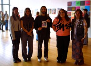 A group of University Studies at West Suffolk College in The Apex. The budding Banksy's work is on display for people to see before they go bit time