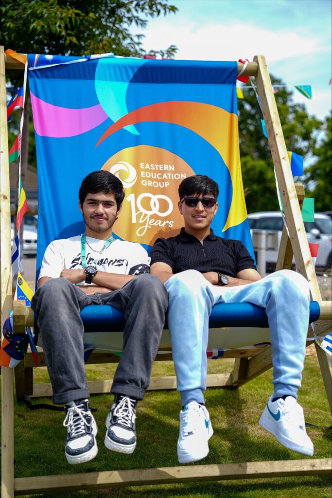 Students Abdul Baset Nayab and Farzad Kakar enjoyed the well-timed sunshine at the event