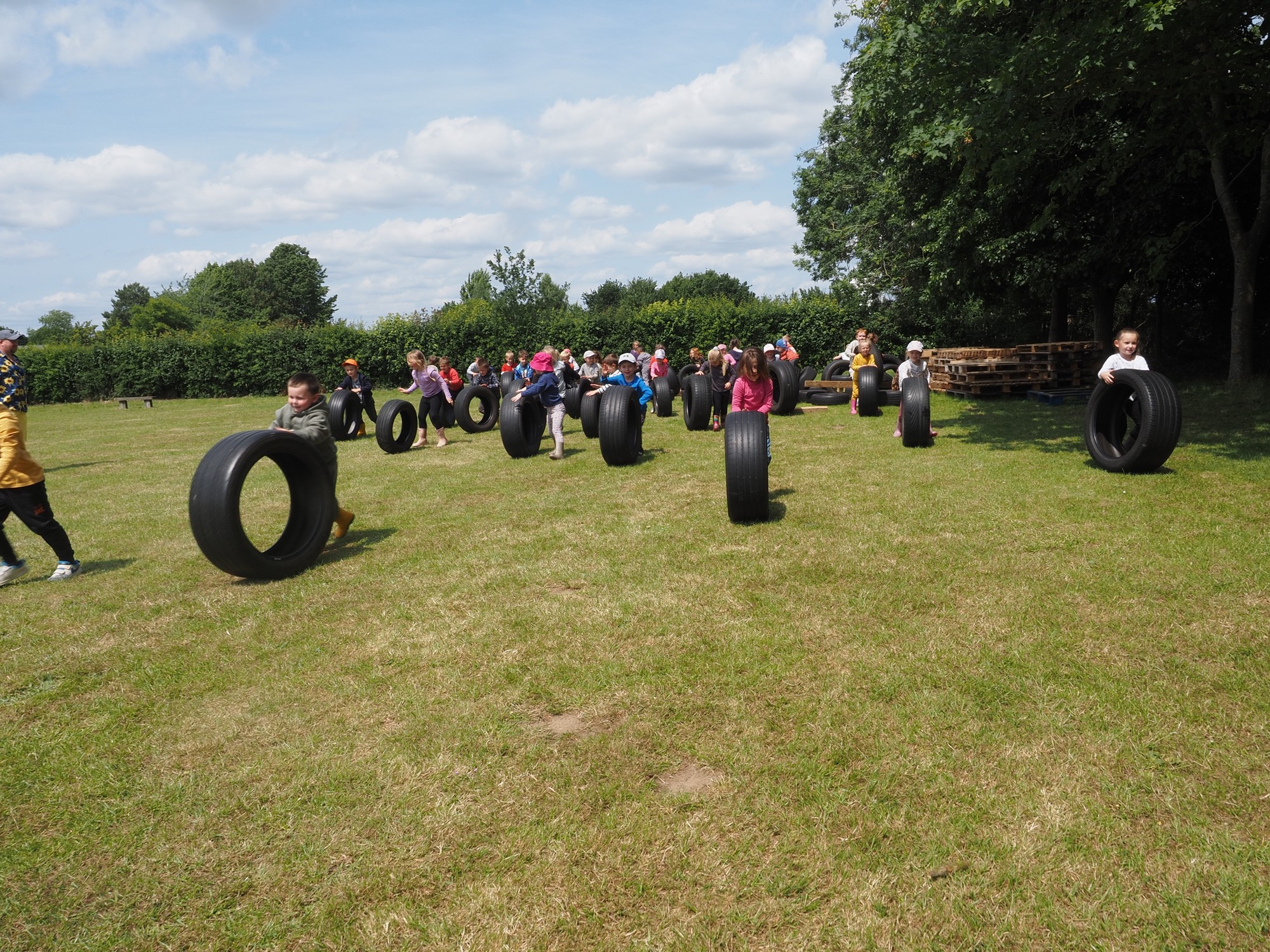 Pupils at Stanton primary school playing with tyres