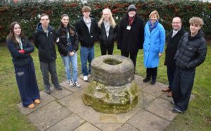 Local residents Martyn Taylor and Melanie Lesser with staff and students from Easter Education Group at the official unveiling of a plague stone plaque in Bury St Edmunds.