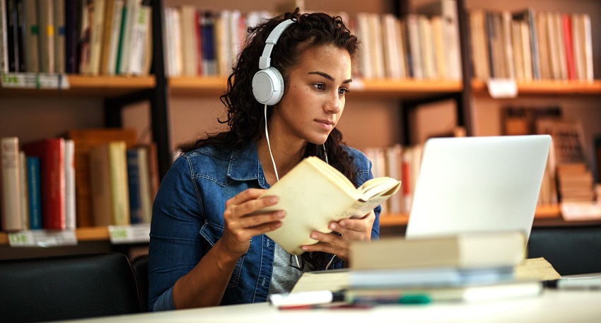 a lady looking at her laptop