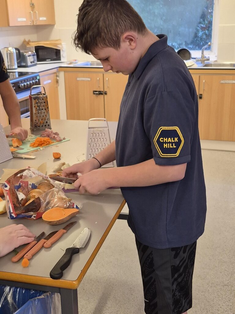 Student cooking at Chalk Hill