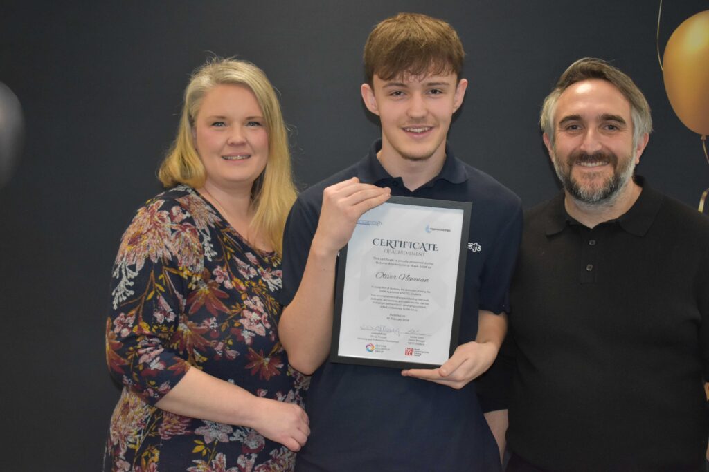 Oliver Newman with his mum and dad (Helen and Wayne) after Oliver recieved ackowledgement for being the 500th apprentice to sign up to a course at NCTC in Chatteris