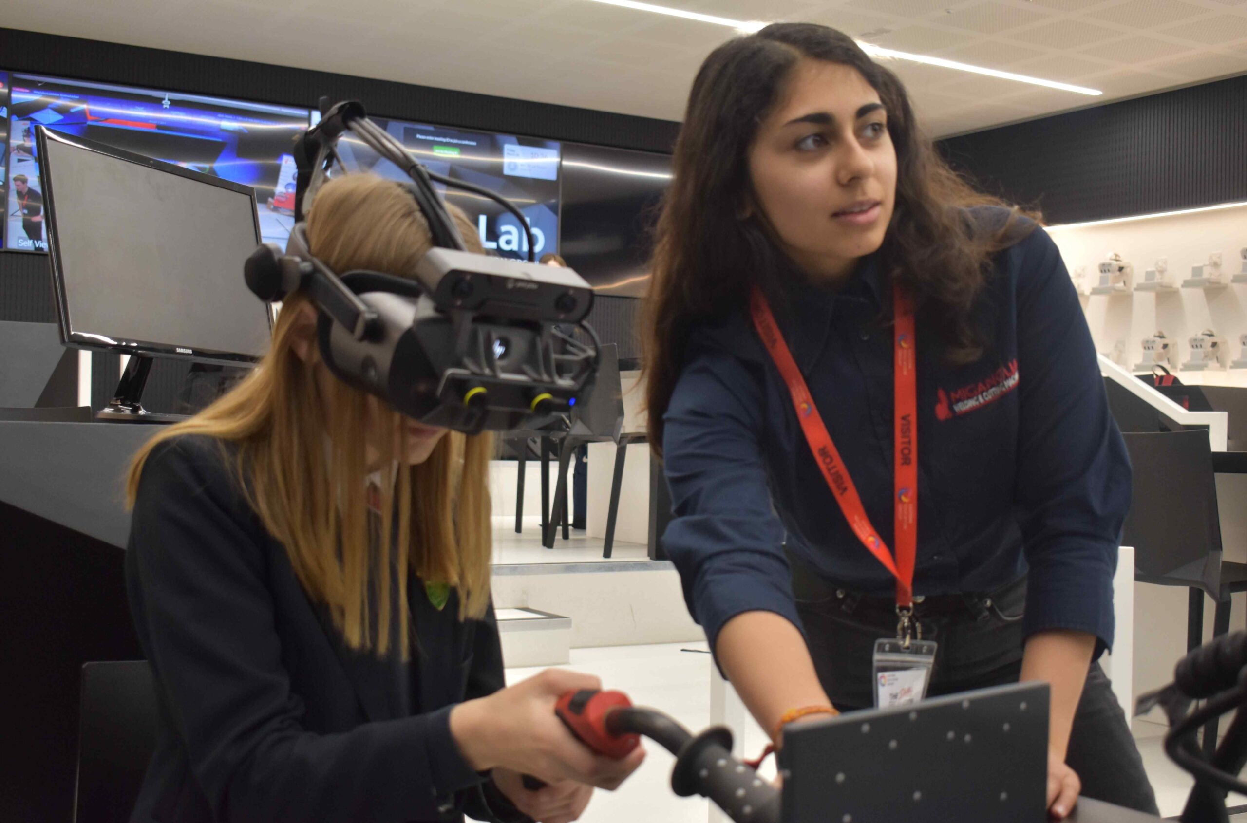 3 A student from Stradbroke tries out virtual welding with Saffron Azeez from Mig Anglia at a construction careers event held in Bury St Edmunds scaled