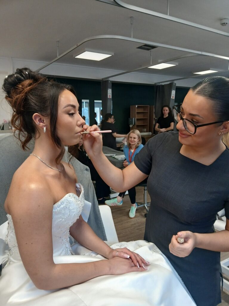 Simona Ciechanow adds the finishing touches on her bridal look