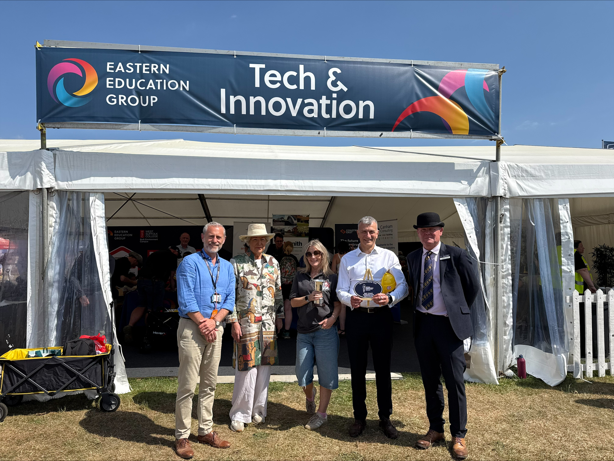 2 EEG wins award for education at Suffolk Show left Mark Tree EEG Carrie Edwards Dr Nikos Savvas OBE DL both EEG third and fourth from left others pictured unknown