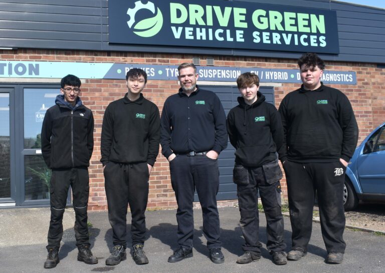 1 Dave Wilson centre with four of the five West Suffolk College students he has supported