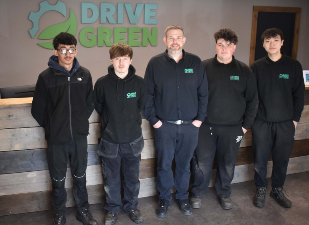 2 Dave Wilson centre with four of the five West Suffolk College students he has supported 2
