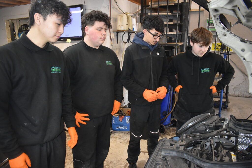 5 William Bradley Ahmet and Leo learning new skills at Drive Green Vehicle Services thanks to Dave Wilson and his team