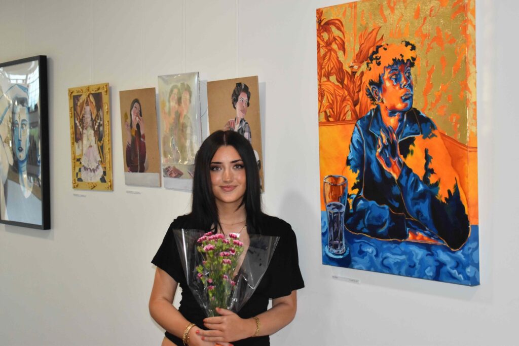 Talented artists brush up nicely as they are celebrated during annual One Sixth Form College Ipswich art extravaganza 5 Ellen Jones with her art at One Sixth Form College