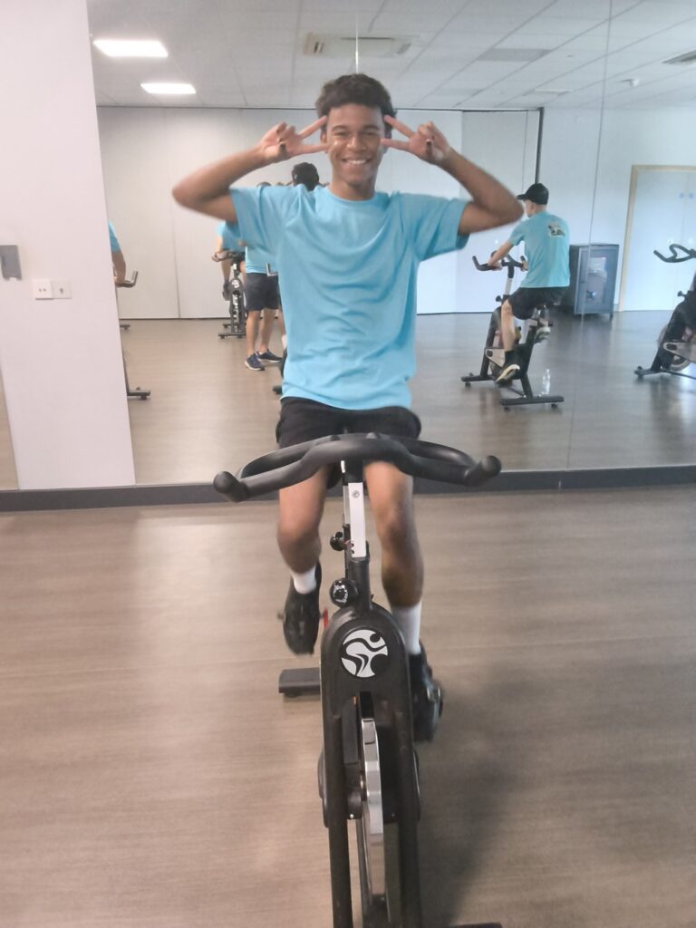 Heatwave can't stop Priory School's charity cyclists 2 Jayden from Priory School in Skyliner Gym pedalling on a stationary bike for the 100-mile ride