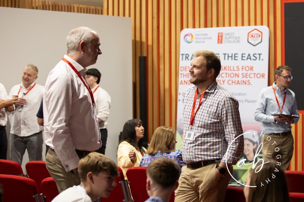 People chatting at the construction ambassador programme.