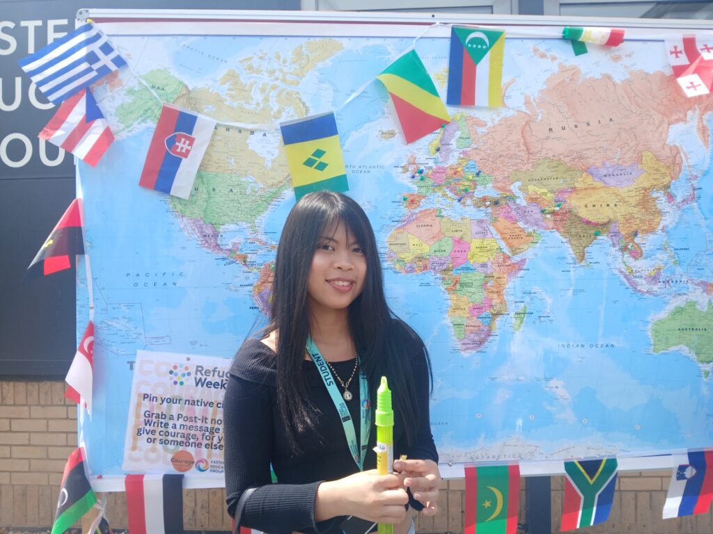 A person with the map of the world behind them