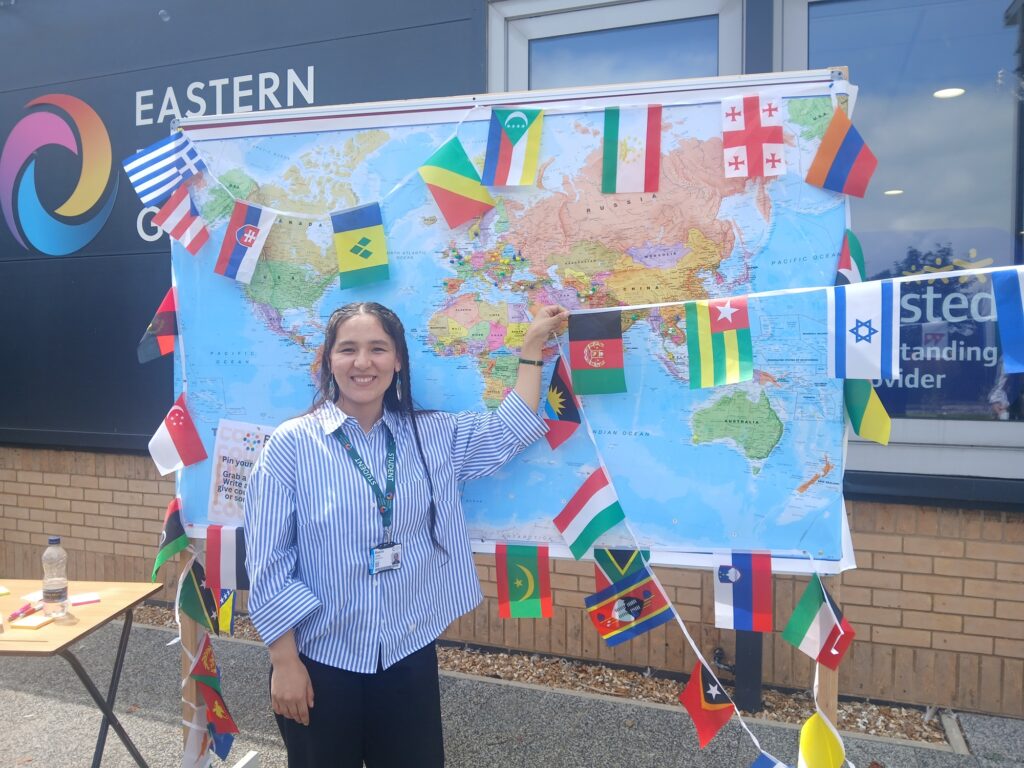 A person by a map of the world