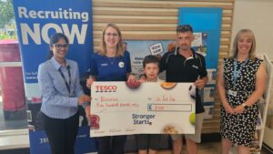 Organiser Harini Jeyakumar attended the cheque presentation with Head Teacher Alison Weir and one of the Year 5 students who participated