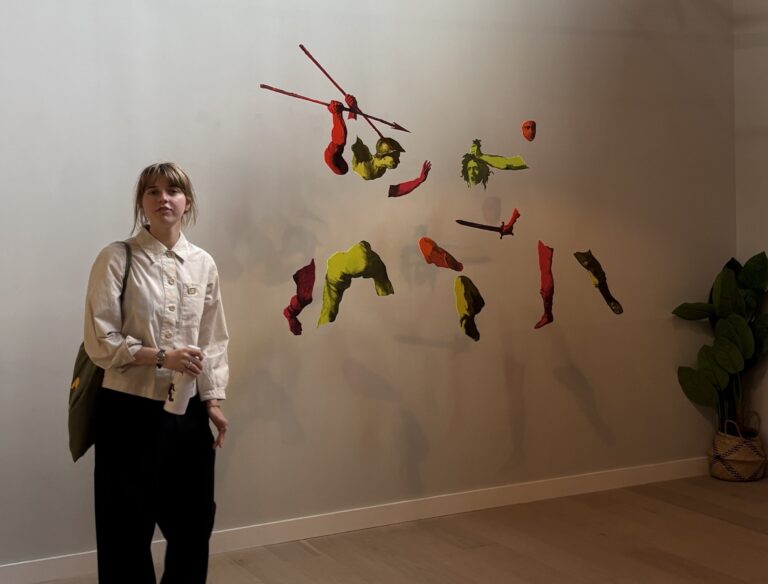 Former West Suffolk College student selected to display in her second art exhibition 2 Rose Boakes 17 next to her art work Perseus turning Phineas and his followers to acrylic