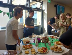 Students serving at Macmillan Coffee Morning at Duke of Lancaster
