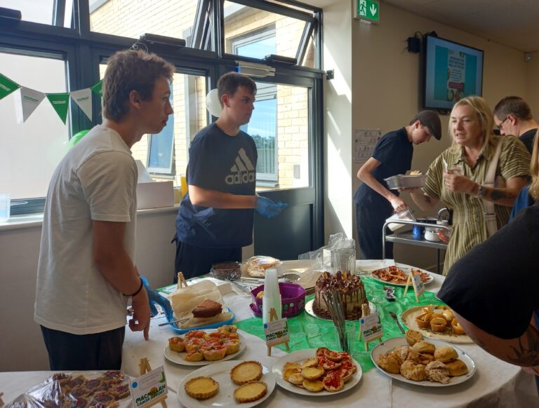 Students serving at Macmillan Coffee Morning at Duke of Lancaster