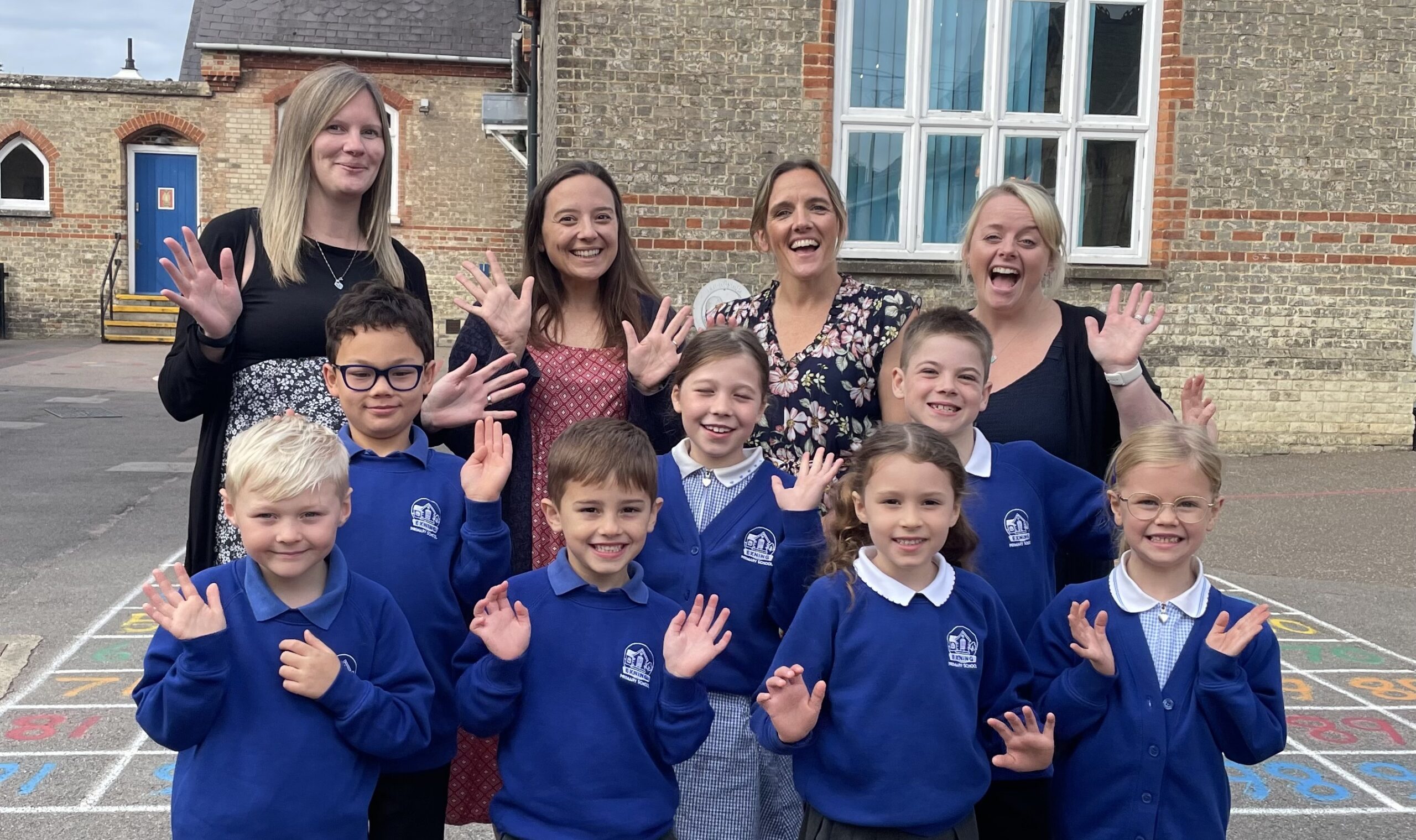 Pupils with teachers at Exning Primary School