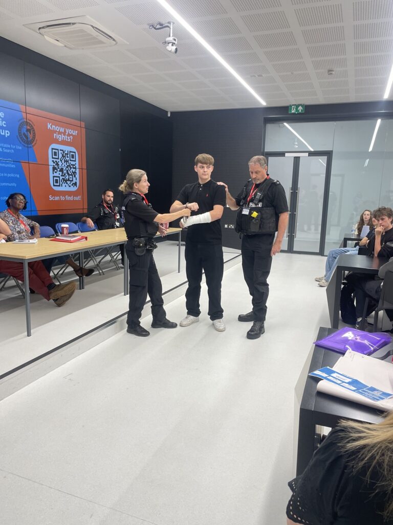 Students in the XR lab taking part in the police scrutiny panel