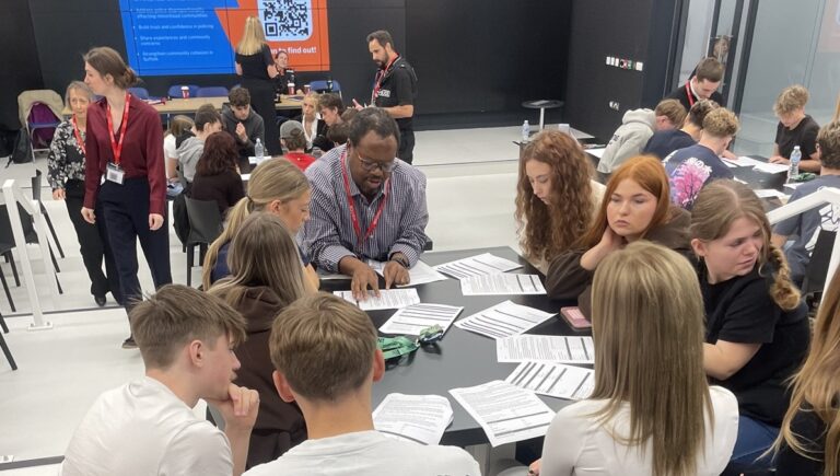 Students in the XR lab taking part in the police scrutiny panel