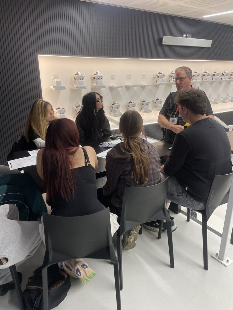 Students in the XR lab taking part in the police scrutiny panel