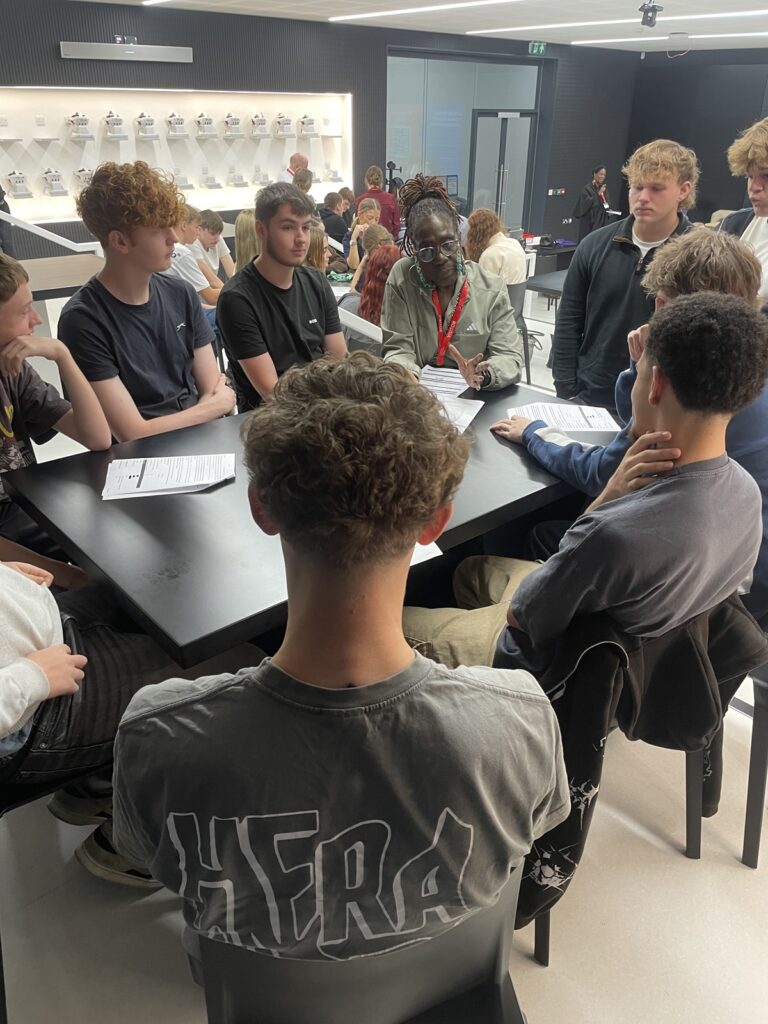 Students in the XR lab taking part in the police scrutiny panel